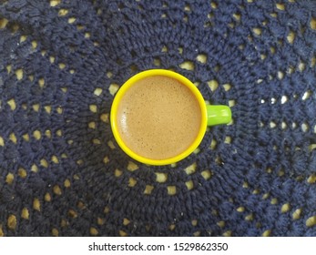 Cup Of Homemade Cappuccino Top Down View With Blue Lace Under It