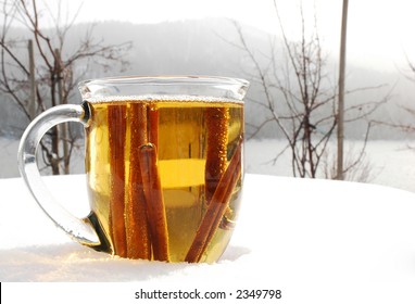 Cup Of Hot Apple Cider Outdoors In The Snowy Winter