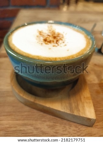 a cup of hot cappuccino
