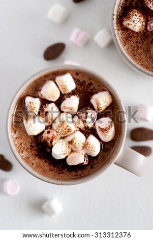Cup of hot chocolate cocoa drink with toasted marshmallows, overhead milky choc dessert beverage