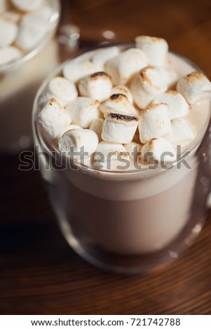 Cup of hot chocolate drink topped marshmallows, a warm cosy winter drink