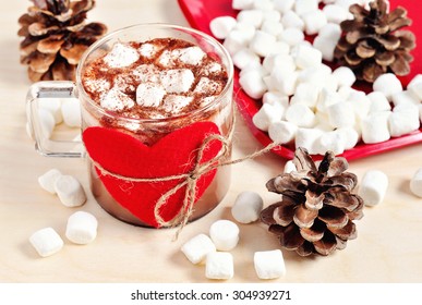 A cup of hot chocolate with marshmallows, holiday decoration, winter, selective focus, toned image - Powered by Shutterstock