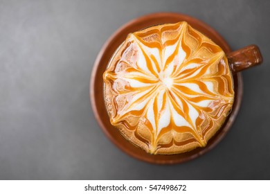 Cup Of Hot Coffee With Caramel On Top , Gray Table Background