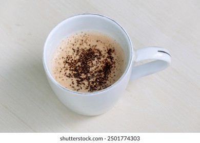 A cup of hot coffee on light wooden surface. - Powered by Shutterstock