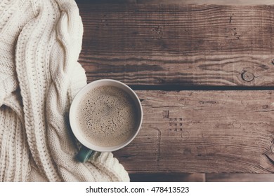 Cup Of Hot Coffee On Rustic Wooden Table, Closeup Photo Warm Sweater With Mug, Winter Morning Concept, Top View