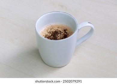 A cup of hot coffee on wooden surface. - Powered by Shutterstock