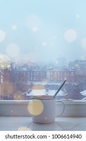 A Cup Of A Hot Drink On The Windowsill In The Snowy Weather