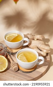  Cup Of Hot Tea With Ginger, Honey And Lemon On The Beige Background Vertical Photo