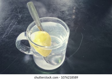 Cup Of Hot Water With Lemon Slices. 