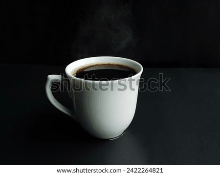  cup and hot white coffee coming out of smoke and black background with space for text