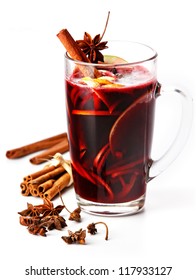 Cup Of Hot Wine With Spices On White Background