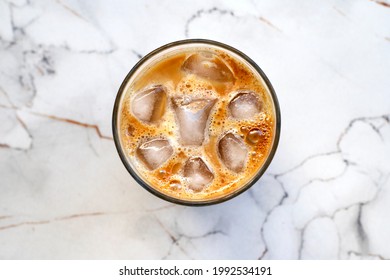 cup of iced coffee on the marble table
