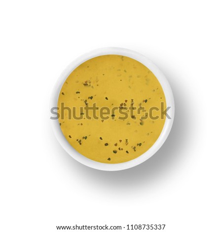 cup of italian dressing isolated on a white background