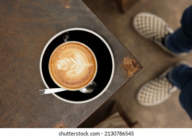 Cup Of Latte Art Coffee And Checkerboard Shoes