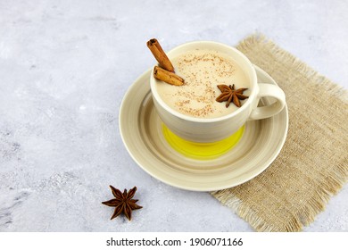 A cup of masala tea. Traditional Indian tea drink with milk and spices.  Close-up.