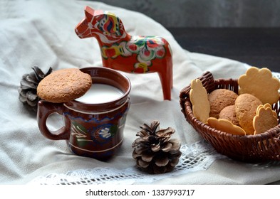 Cup With Milk, Cookies And Scandinavian Horse Dalahast