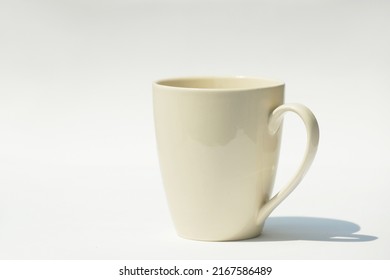A cup on white and shadow, A cup of coffee. - Powered by Shutterstock