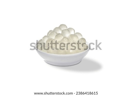 Cup of Pearls Bubble Tea closeup isolated on white background. Bowl of konjac 3Q boba pearls tapioca use for topping milk tea drinks. color jelly tapioca for bubbles drinks                     