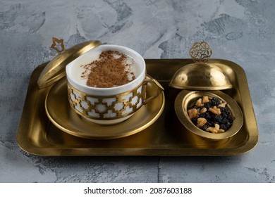 Cup of salep milky traditional hot drink of Turkey with cinnamon served  in a vintage cup