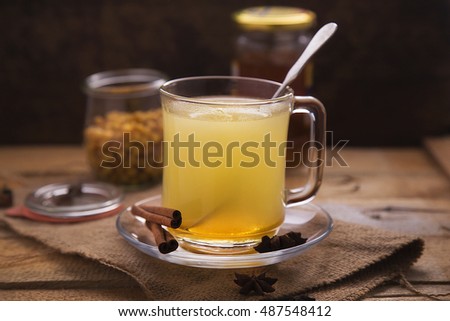 A cup of spicy tea with berries