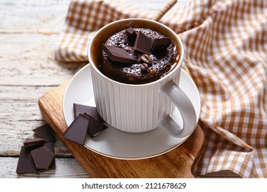 Cup With Tasty Chocolate Brownie On White Wooden Background