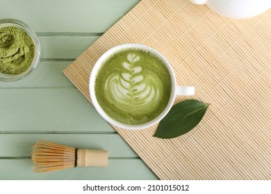 Cup Of Tasty Matcha Coffee With Powder On Table