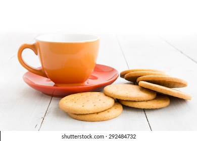 Cup Of Tea And Biscuits On Wood