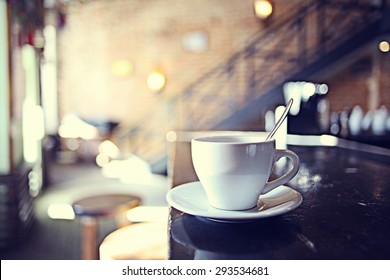 cup of tea at a cafe blurred background