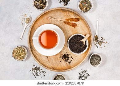 A Cup Of Tea And Coockies And Sugar On A Wooden Tray. Various Types Of Tea. View From Above.