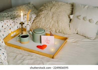 A cup of tea with delicious cookies with postcard I love you. Celebrating Valentine's Day at home. Concept of Valentine's Day - Shutterstock ID 2249836595