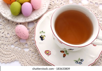 Cup Of Tea And Easter Eggs On Beautiful Napkin