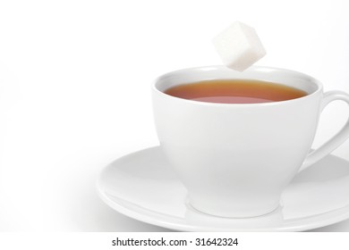 Cup Of Tea With Falling Sugar Cube