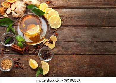 Cup of tea with ginger and cinnamon on wooden background - Powered by Shutterstock