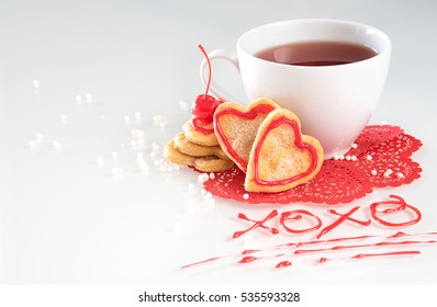 A cup of tea with heart shape cookies on valentines day  - Powered by Shutterstock