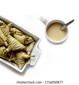 Cup Of Tea And  Ketupat On White Background.
Ketupat, Special Dish Served At Eid Mubarak / Idul Fitri Celebration In Malaysia, Brunei And Indonesia.