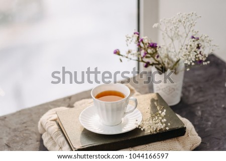 Similar – Still life with cup of tea at the window