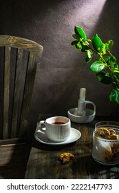 A Cup Of Tea, Leaf, Candle, Biscuit On The Table, Selective Focus