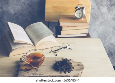 A Cup Of  Tea With Tea Leaf And Old Books In Room