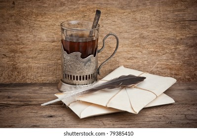 cup of tea  and mail envelopes