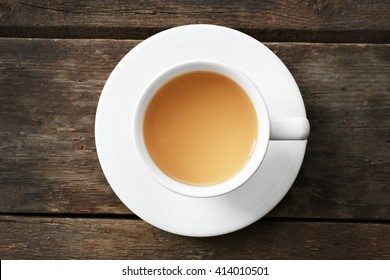 Cup Of Tea With Milk On Wooden Background, Top View