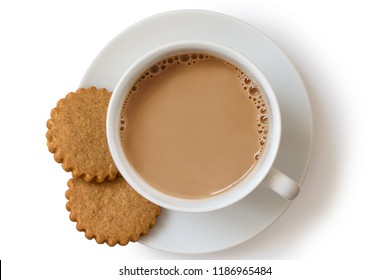 A Cup Of Tea With Milk And Two Gingerbread Biscuits Isolated On White From Above. White Ceramic Cup And Saucer.