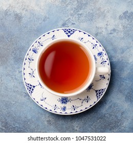 Cup Of Tea On A Blue Stone Background. Copy Space. Top View.