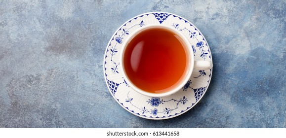 Cup Of Tea On A Blue Stone Background. Copy Space. Top View