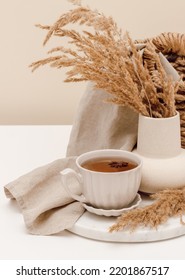 Cup Of Tea On Marble Stand With Vase And Linen Cloth At The Background. Aesthetic Home Decoration, Boho Style