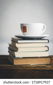 Cup of tea on a stack of books. Close-up. 