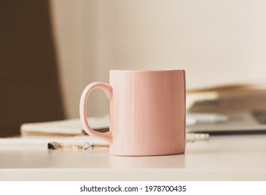 Cup of tea on table in office