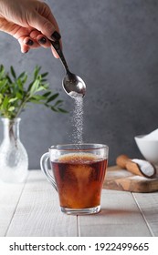 In A Cup Of Tea, Pour A Sugar Substitute From A Teaspoon. Stevia, Erythritol.