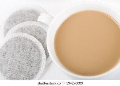 Cup Of Tea - Simple Cup Of Tea With Milk And Tea Bags On A White Background Shot From Above.