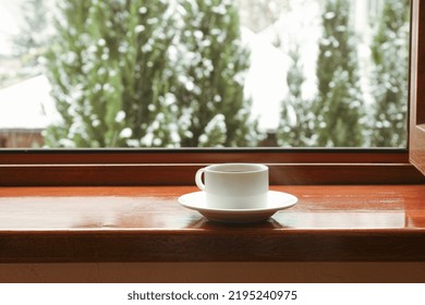 Cup Of Tea Stands On Wooden Windowsill