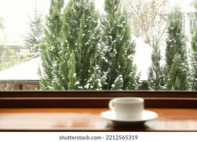 Cup Of Tea Stands On Wooden Windowsill